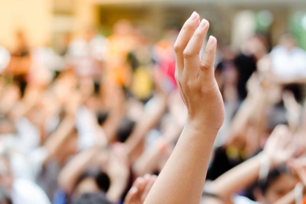 Hand raised in crowd of peaceful protestors