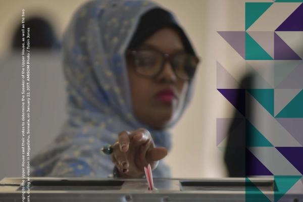 Somali woman posting vote into ballot box