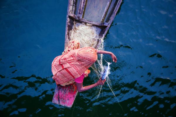 An image of a woman fishing